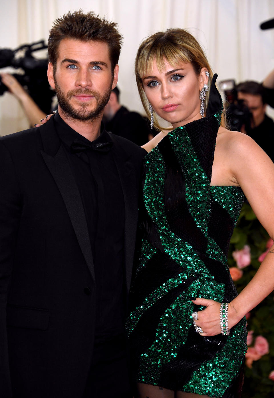 Miley Cyrus and Liam Hemsworth not smiling
