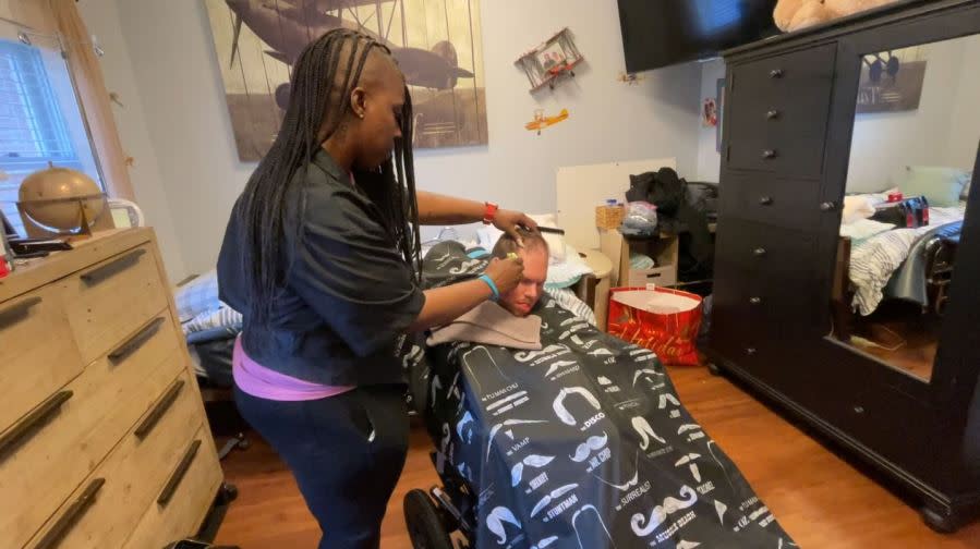 Leathers cutting her client’s hair (Chloe Rafferty/CBS 17)