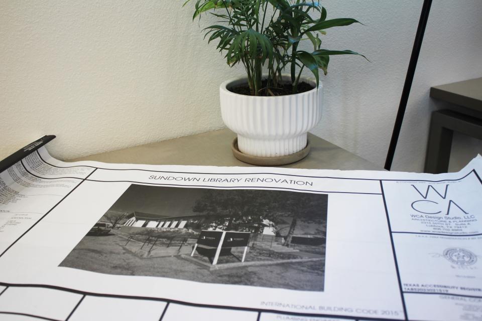 Construction plans lie on a table at the City of Sundown Library Thursday, Jan. 18, 2024, in Sundown. An old church was renovated to become the city's new library.