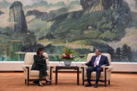 FILE - U.S. Commerce Secretary Gina Raimondo, left, talks to Chinese Premier Li Qiang during a meeting at the Great Hall of the People in Beijing on Aug. 29, 2023. (AP Photo/Andy Wong, Pool, File)