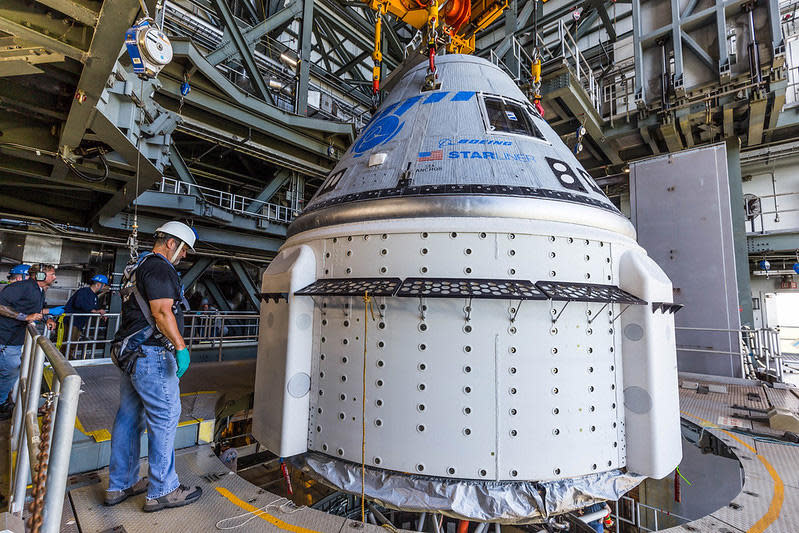 Boeing's Starliner crew capsule during attachment to a United Launch Alliance Atlas 5 rocket in ULA's Vertical Integration Facility.  / Credit: United Launch Alliance