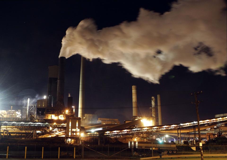 In this July 8, 2011 file photo, smoke bellows from a chimney stack at BlueScope Steel's mill at Port Kembla, south of Sydney, Australia. Australia was the worst climate performer among comparable developed countries since the 2015 Paris Agreement imposed binding commitments to limit global warming, a think tank reported on Thursday Oct. 21, 2021, ahead of an important conference in Scotland later this month. (AP Photo/Rob Griffith, File)