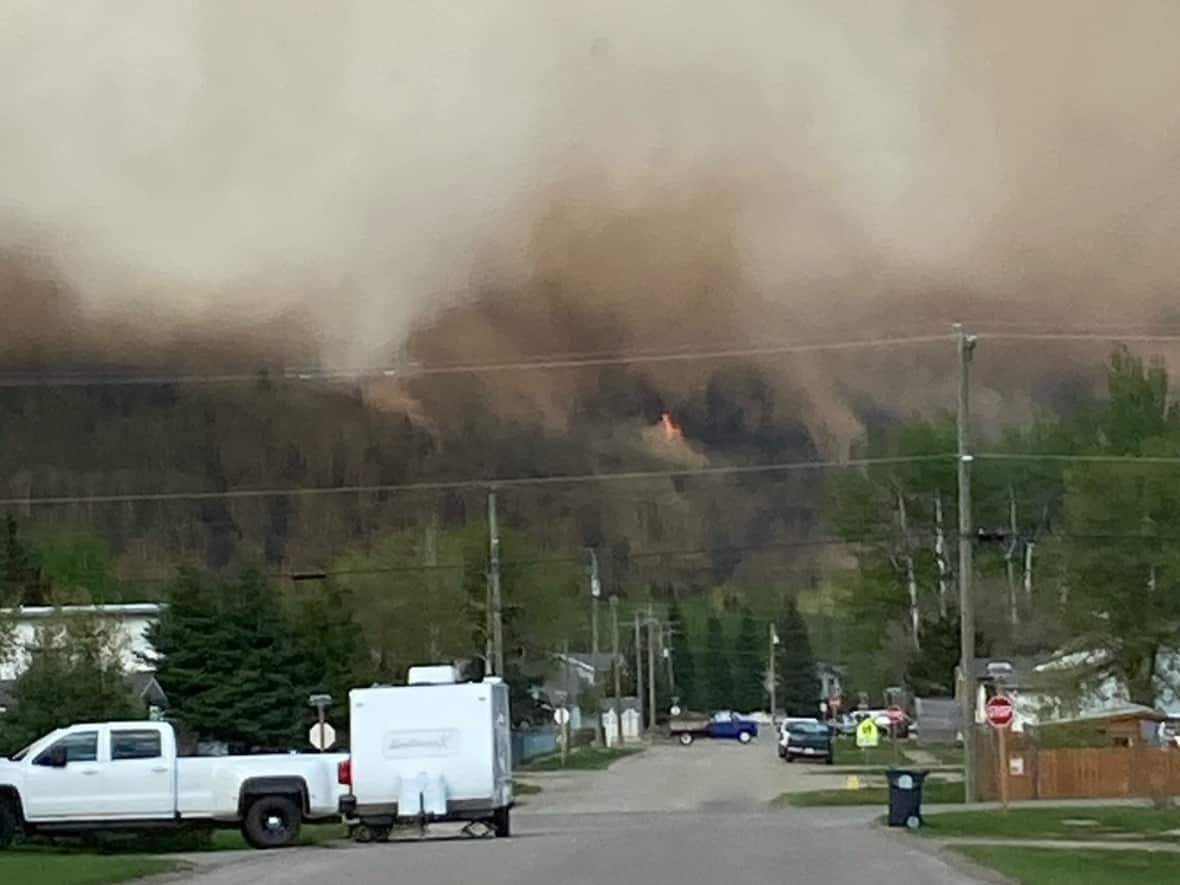 An out-of control wildfire is burning six kilometres east of McBride, B.C.  (Submitted by E.Bouwman - image credit)