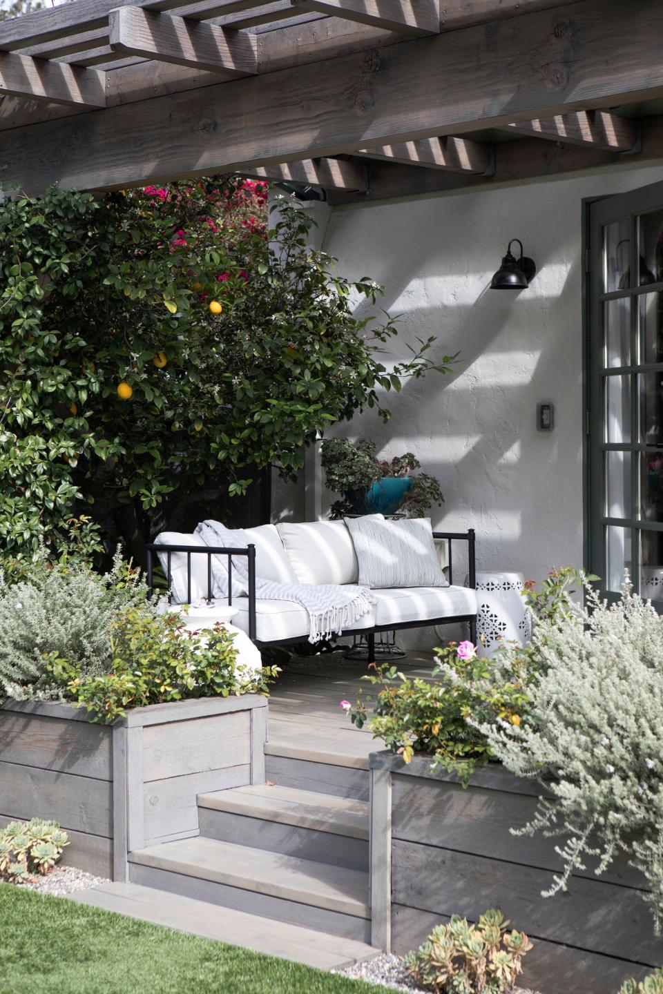 A few decorative details, like throw pillows or an outdoor rug, can transform your patio or porch.