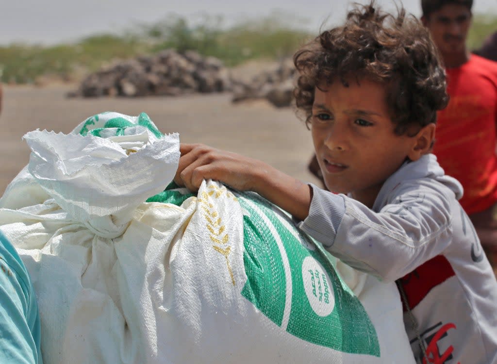 The UN provides food assistance to 13 million people per month in Yemen but rations have been halved  (AFP via Getty Images)