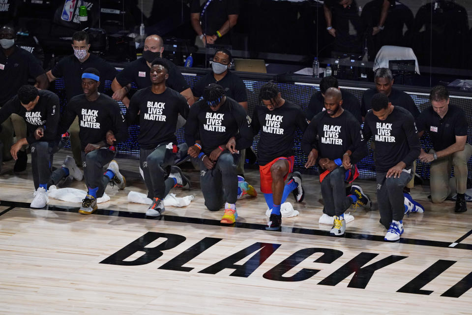 Thunder players kneel before Saturday's game against the Jazz. (AP Photo/Ashley Landis, Pool)