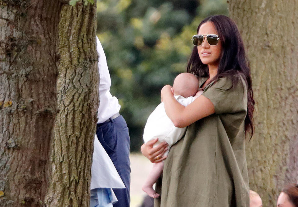 Meghan holds Archie at the the King Power Royal Charity Polo Match.