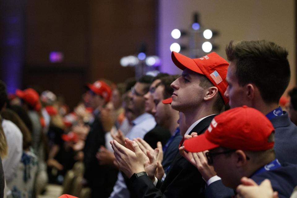 Supporters stand and applaud as President Donald Trump speaks at Turning Point USA's Teen Student Action Summit 2019, Tuesday, July 23, 2019, in Washington. (AP Photo/Alex Brandon)