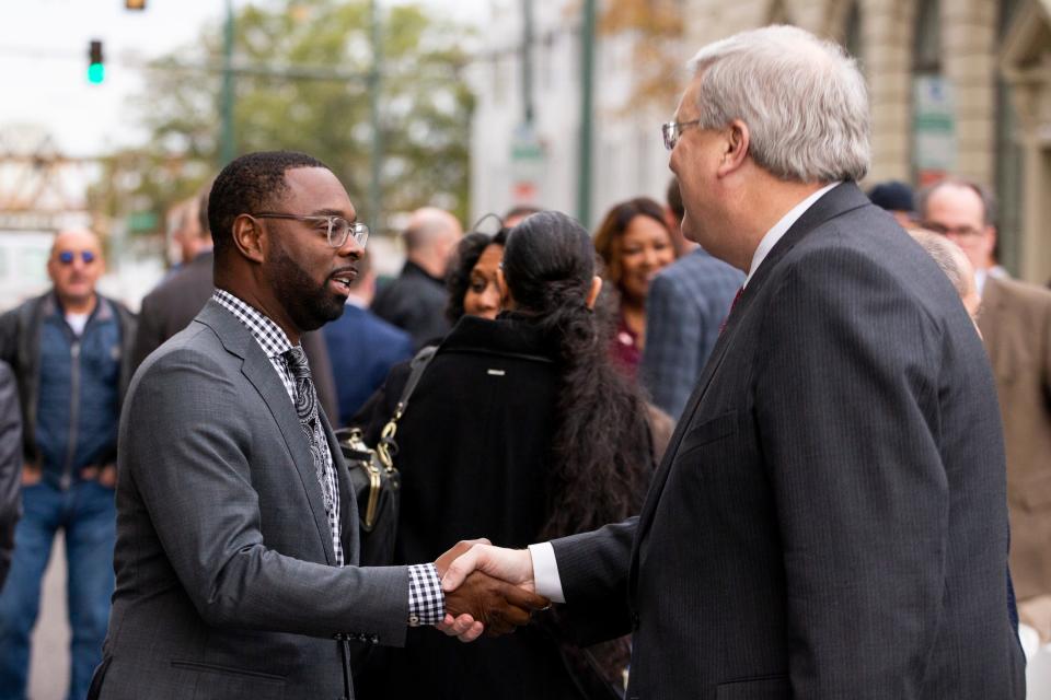 Memphis Mayor-elect Paul Young and Memphis Mayor Jim Strickland greet each other prior to the ceremonial groundbreaking for 100 N. Main redevelopment in Downtown Memphis on Thursday, November 30, 2023.