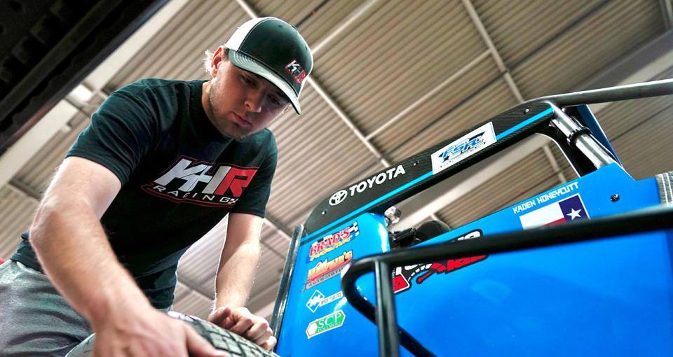 Kaden Honeycutt inspects his tires during the 2023 Lucas Oil Chili Bowl Nationals presented by General Tire at Tulsa Expo Raceway in Tulsa, Oklahoma on January 14, 2023. (Nick Oxford/NASCAR)