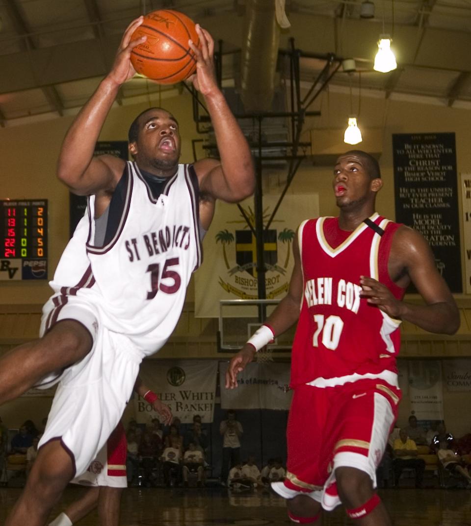 St. Benedict's Samardo Samuels, left, shoots past Helen Cox's Greg Monroe, right, during their City of Palms semifinal game at Bishop Verot Friday night, Dec. 21, 2007.