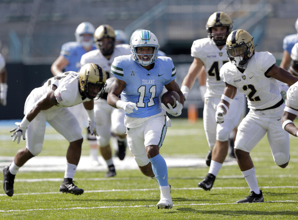 Tulane running back Amare Jones (11) goes for 50 yards against the Army during an NCAA college football game in New Orleans, La., Saturday, Nov. 14, 2020. (A. J. Sisco/The Advocate via AP)