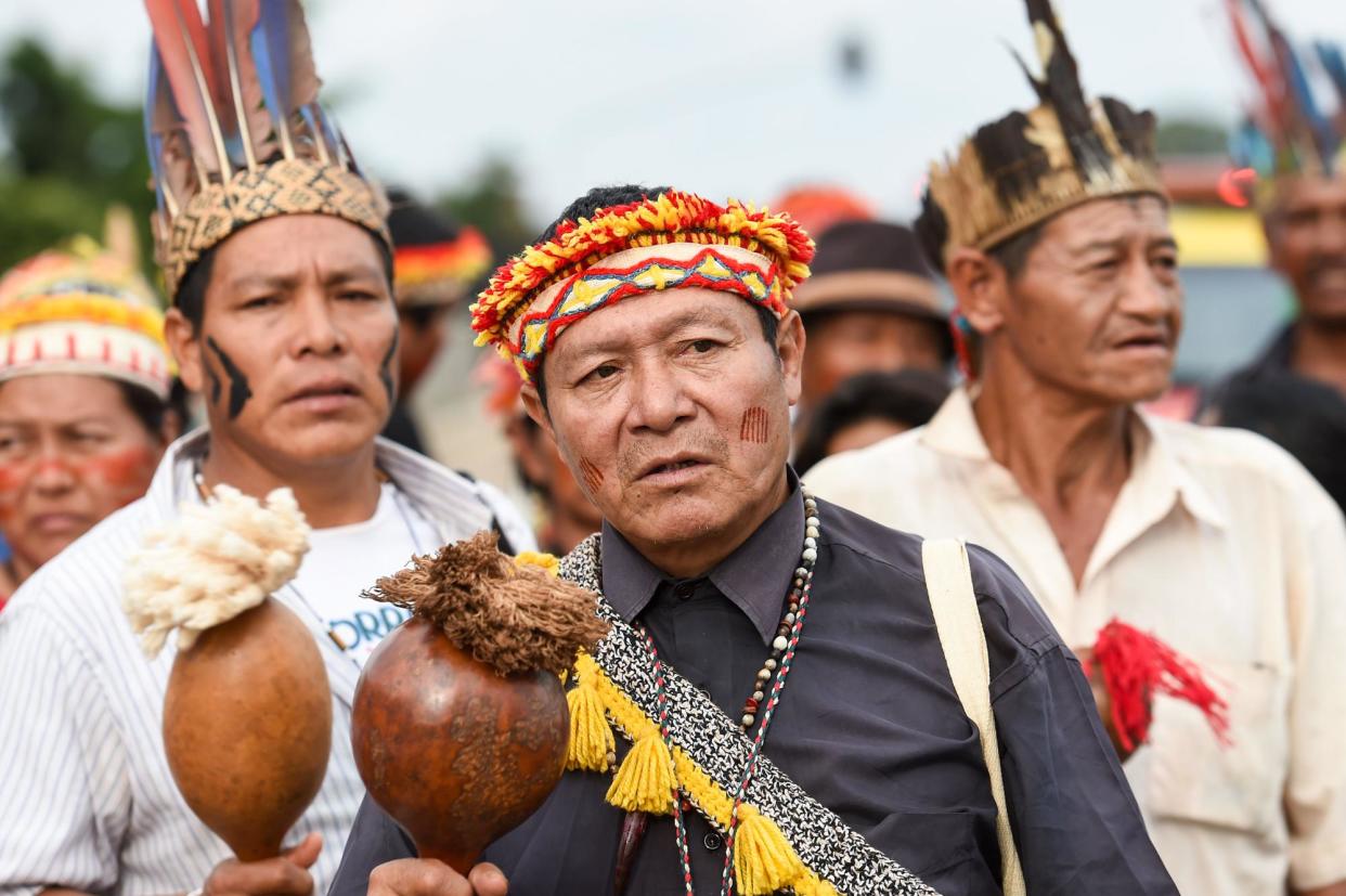<span>Indigenous people of the Guarani-Kaiowá tribe protest in Brasília, Brazil, on 17 May 2016.</span><span>Photograph: Evaristo Sa/AFP via Getty Images</span>
