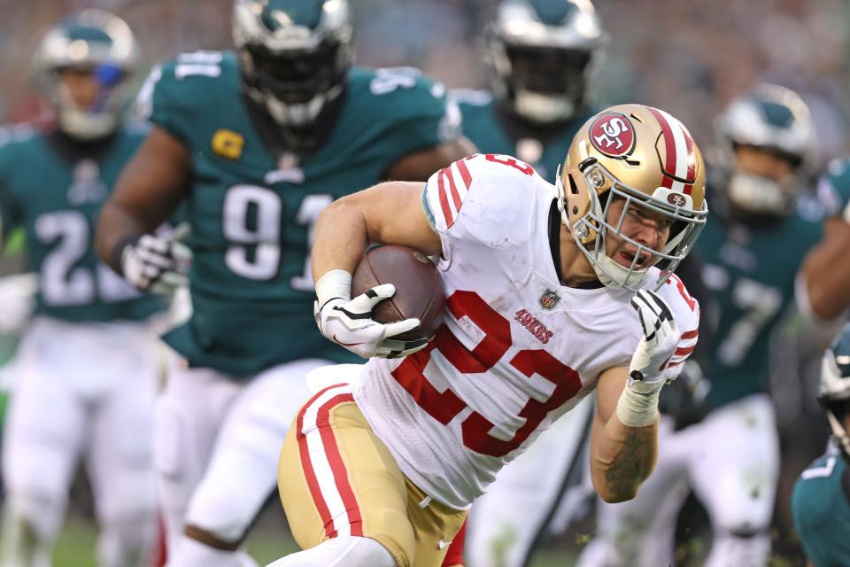 San Francisco 49ers running back Christian McCaffrey (23) on his way to a 23-yard touchdown run against the Philadelphia Eagles during the second quarter in the NFC Championship game at Lincoln Financial Field.
