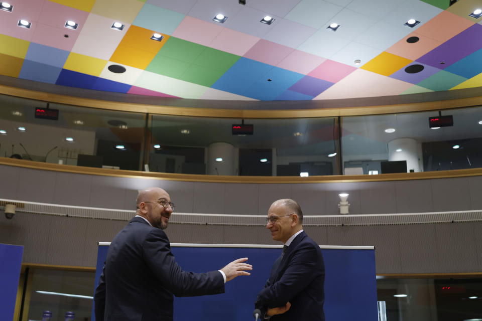 European Council President Charles Michel, left, speaks with author of the High-Level Report on the future of the Single Market, Enrico Letta, as they arrive for an EU summit in Brussels, Thursday, April 18, 2024. European Union leaders vowed on Wednesday to ramp up sanctions against Iran as concern grows that Tehran's unprecedented attack on Israel could fuel a wider war in the Middle East. (AP Photo/Omar Havana)