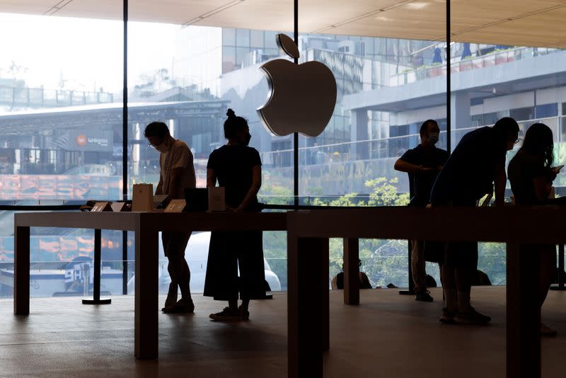 People look at Apple products as Apple Inc's new iPhone 14 models go on sale in Beijing