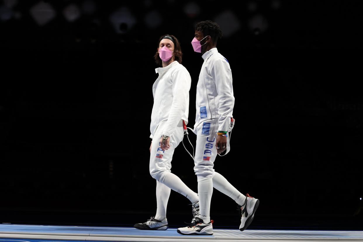 Jacob Hoyle of Team United States, left, and Curtis McDowald of Team United States react to their loss to Team Japan in Men's Épée Team Table of 16 on day seven of the Tokyo 2020 Olympic Games at Makuhari Messe Hall on July 30, 2021 in Chiba, Japan. (Getty Images)