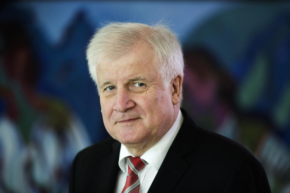 FILE - In this Oct. 10, 2018 file photo German Interior Minister Horst Seehofer arrives for the weekly cabinet meeting of the German government at the chancellery in Berlin. Germany's top security official, who has frequently criticized Chancellor Angela Merkel's migrant policy, is reportedly planning to quit his post in government. German news agency dpa quoted multiple unnamed party officials as saying Horst Seehofer told a meeting of the Christian Social Union on Sunday that he plans to relinquish its leadership and his role as interior minister in Merkel's government. (AP Photo/Markus Schreiber, file)