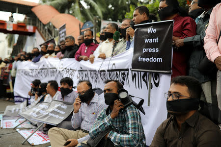 Journalists hold banners and placards as they protest against the newly passed Digital Security Act in front of the Press Club in Dhaka, Bangladesh, October 11, 2018. REUTERS/Mohammad Ponir Hossain