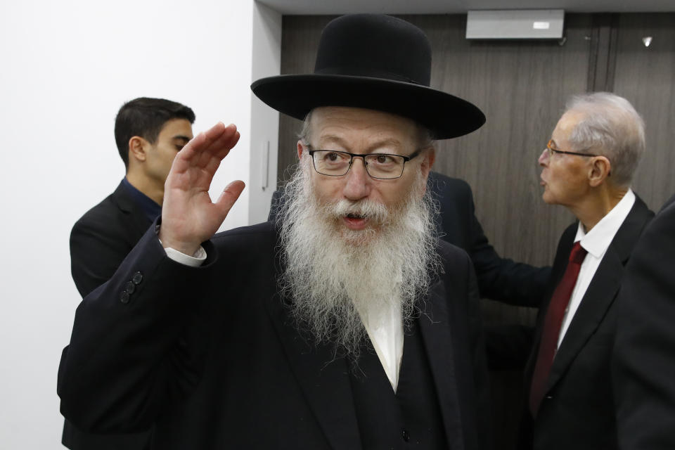 FILE - In this Feb. 23, 2020 file photo, Israeli Health Minister Yaakov Litzman arrives for a situation assessment meeting regarding the Coronavirus, in Tel Aviv, Israel. Housing Minister Yaakov Litzman, who served as health minister during the initial outbreak of the virus, resigned Sunday, Sept 13, 2020, in protest over the government’s plan to impose a nationwide lockdown this week ahead of the Jewish New Year due to rising coronavirus cases. (Jack Guez/Pool via AP, File)