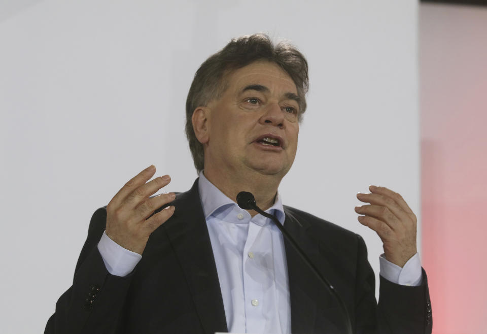 Werner Kogler head of the Austrian Greens speak to journalists during a press conference about the government program with Sebastian Kurz head of the Austrian People's Party, OEVP, in Vienna, Austria, Thursday, Jan. 2, 2020. (AP Photo/Ronald Zak)