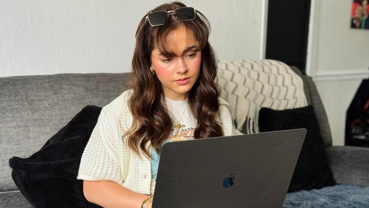 Macy Landon-Jones with her laptop