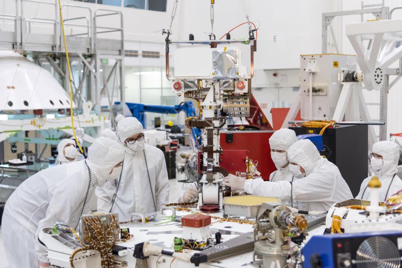 Handout photo of members of NASA's Mars 2020 project assembling the Mars 2020 rover in Pasadena