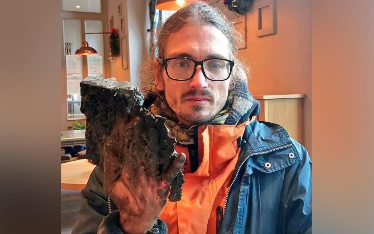 Raul Semmler was left with a chunk of tarmac stuck to his hand after police had to use a jackhammer to cut around his fingers - CEN