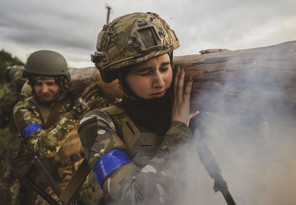 Female service members of the Ukrainian Army's 128th Carpathian Mountain Assault Brigade train in different combat scenarios in Zaporizhzhia on July 15, 2023. (Photo by Ercin Erturk/Anadolu Agency via Getty Images)