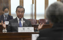 Chinese Foreign Minister Wang Yi, left, talks with South Korean Foreign Minister Kang Kyung-wha, right, during their meeting at the foreign ministry in Seoul, South Korea, Thursday, Nov. 26, 2020. Wang arrived in Seoul on Nov. 25, for a three-day state visit.(Kim Min-hee/Pool Photo via AP)