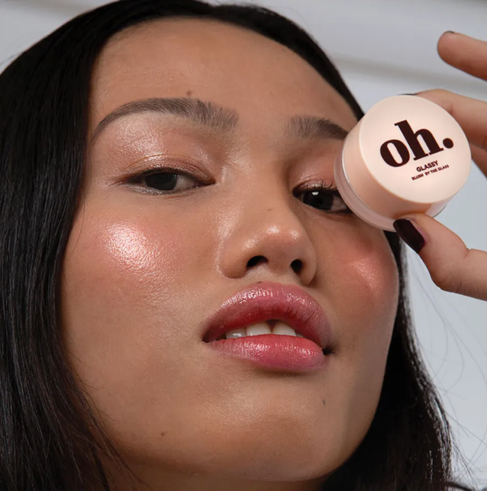 Woman holding Espressoh’s Glassy Blush