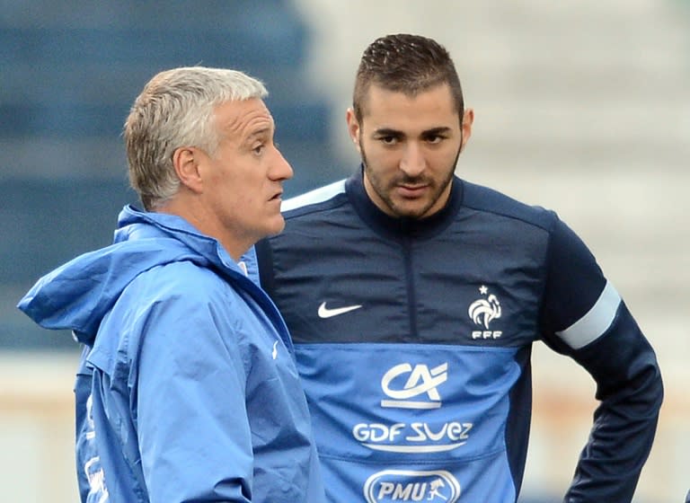 Karim Benzema (R) claimed "a racist part of France" was to blame for his exclusion from the French side, coached by Didier Deschamps (L)