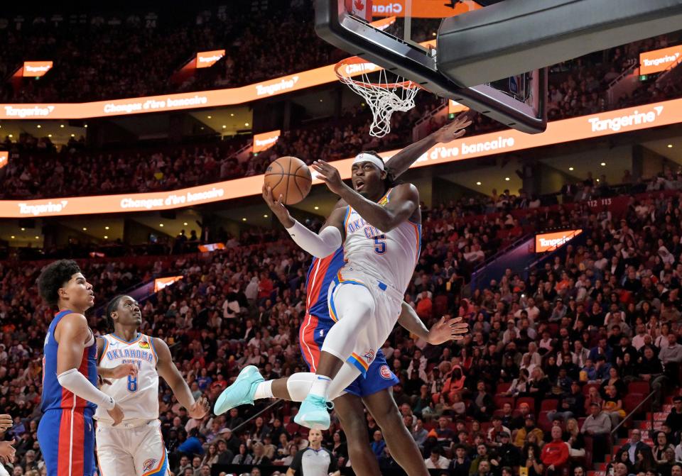Oklahoma City guard Luguentz Dort attempts a shot near the rim during Thursday's game against Detroit in Montreal.
