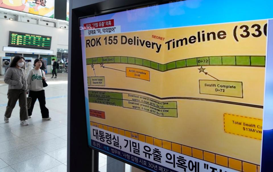 A TV screen shows a news program reporting on the leaked Pentagon documents at the Seoul Railway Station in Seoul, South Korea. (Associated Press)