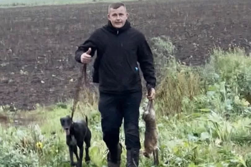 The snap of Lewis Sheridan with his dog and a hare was discovered after he and his partner-in-crime George Miller were arrested -Credit:Lincolnshire Police