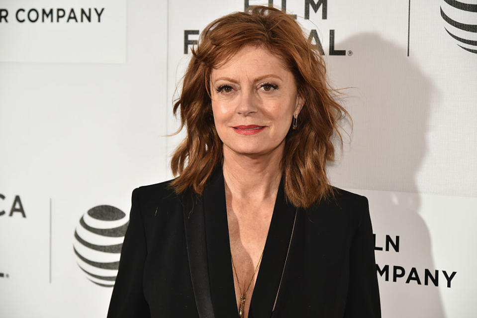 Close-up of Susan in a suit jacket at a media event