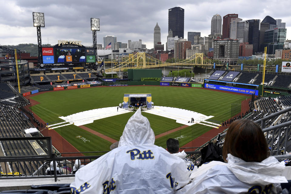 Family and friends watch as students receive their diplomas duirng the University of Pittsburgh's commencement exercise, Tuesday, May 4, 2021, at PNC Park in Pittsburgh. (Matt Freed/Pittsburgh Post-Gazette via AP)