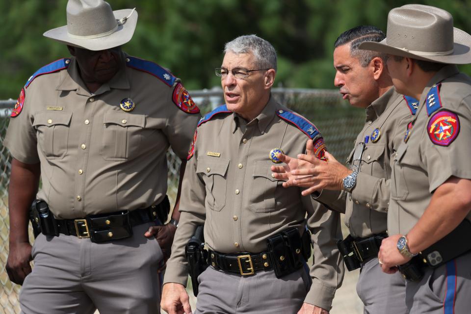 Steven McCraw, director and colonel of the Texas Department of Public Safety, speaks with DPS State Troopers near Robb Elementary School on May 30 in Uvalde, Texas.