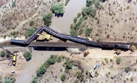 Removal of passenger cars continues from the Amtrak Sunset Limited that crashed October 9, 1995 near Hyder, Arizona, 60 miles west of Phoenix in this October 11, 1995 aerial file photo. REUTERS/Stringer/Files