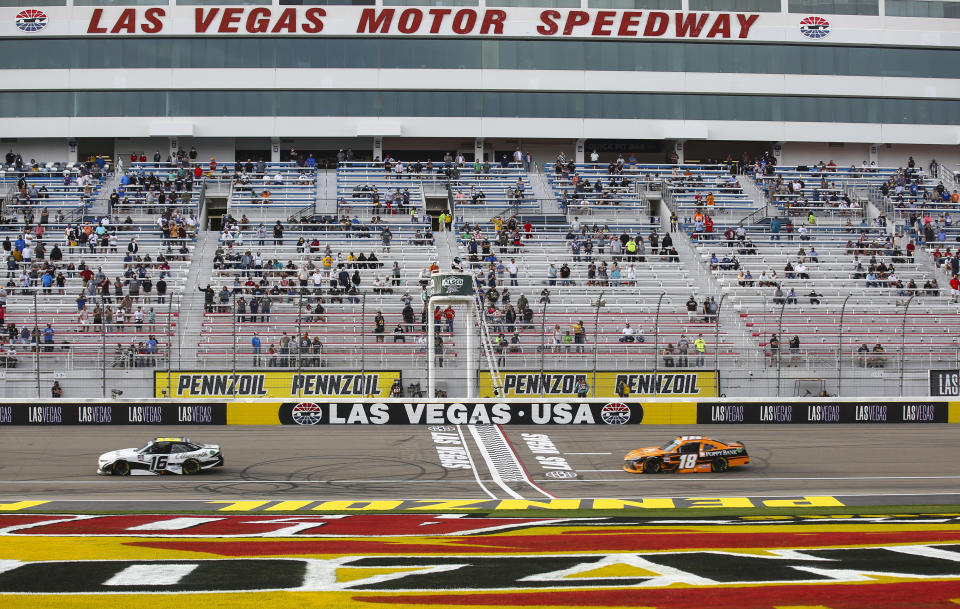 AJ Allmendinger (16) maintains a lead over Daniel Hemric (18) in the final laps of a NASCAR Xfinity Series auto race at Las Vegas Motor Speedway, Saturday, March 6, 2021. (Chase Stevens/Las Vegas Review-Journal via AP)