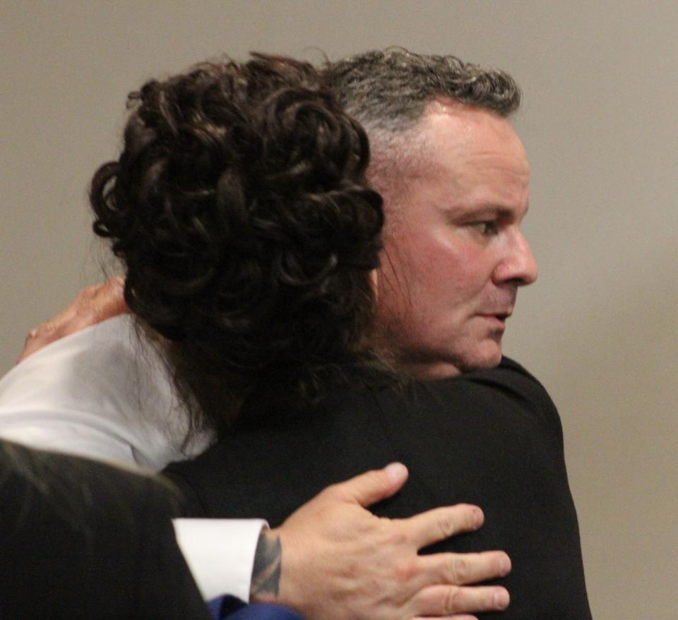 Ex-Daytona Beach Police Officer Shane Jackson hugs his mother on Thursday before he was led away to jail after a jury found him guilty of felony battery in a stabbing two years ago outside a New Smyrna Beach bar.