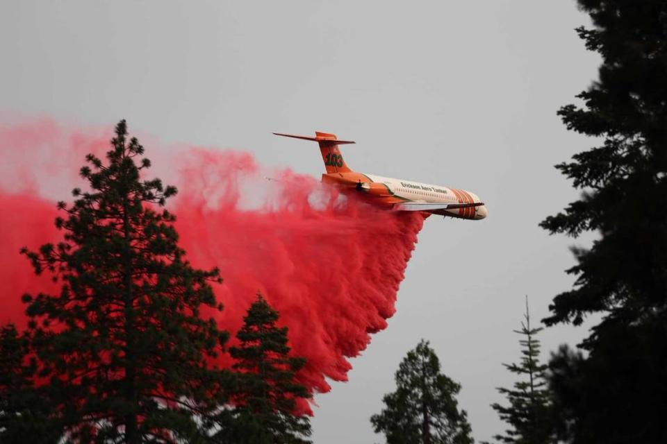 An Erickson Aero Tanker drops fire retardant on the Park Fire that on Monday July 29, 2024, became the became the sixth-largest wildfire in California history.