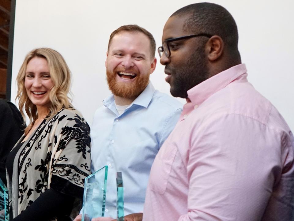 Kitsap Sports Hall of Fame inductees (from left) Nicole Zygmontowicz, Drew Vettleson and Larry Dixon pose for photos after Saturday's ceremony.