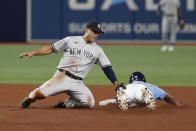 New York Yankees shortstop Isiah Kiner-Falefa tags out Tampa Bay Rays' Randy Arozarena on a steal attempt at second base during the fifth inning of a baseball game Friday, May 27, 2022, in St. Petersburg, Fla. (AP Photo/Scott Audette)