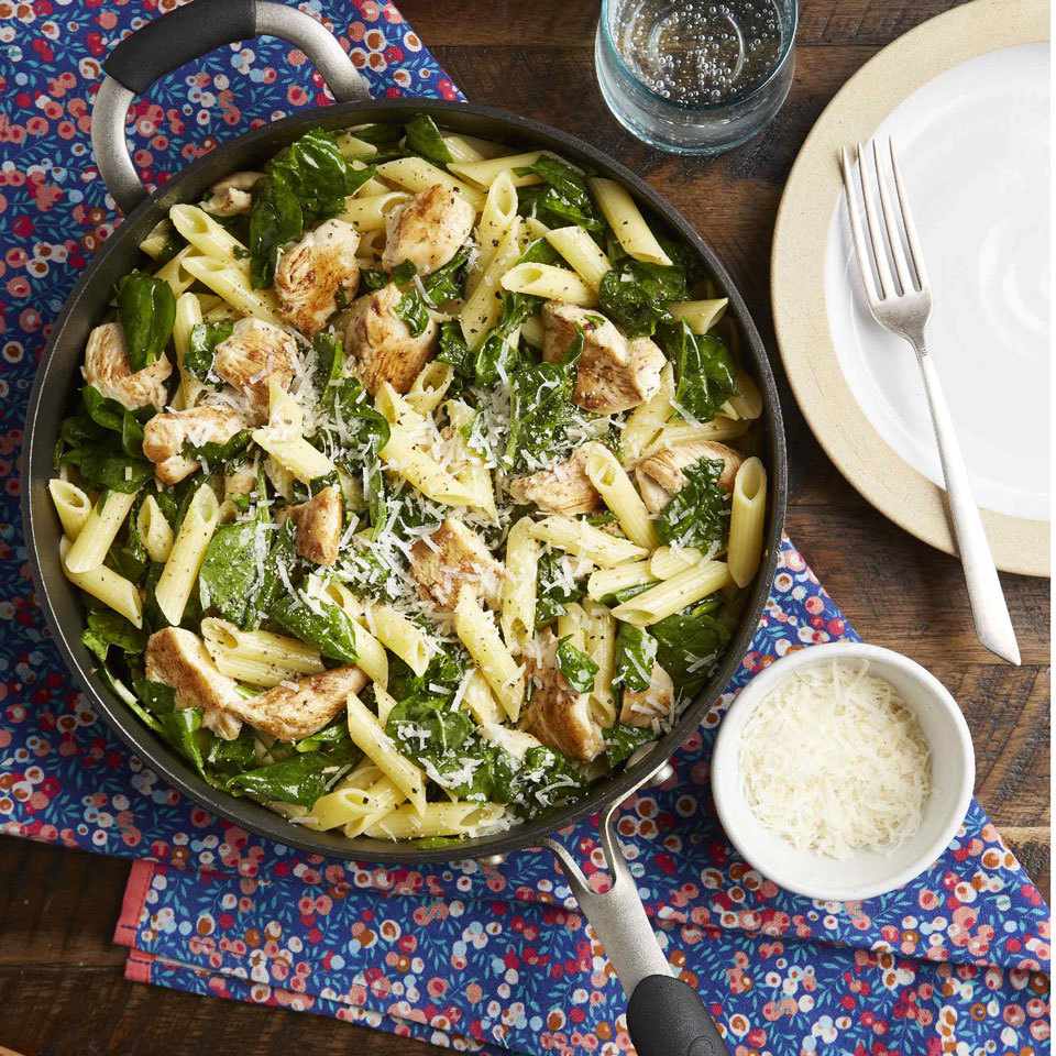 <p>This one-pan pasta that combines lean chicken breast and sautéed spinach for a one-bowl meal is garlicky, lemony and best served with a little Parm on top. I call it "Mom's Skillet Pasta" and she called it "Devon's Favorite Pasta." Either way it's a quick and easy weeknight dinner we created together and scribbled on a little recipe card more than a decade ago, and it remains in my weekly dinner rotation to this day. It's a simple dinner the whole family will love. <a href="https://www.eatingwell.com/recipe/267768/chicken-spinach-skillet-pasta-with-lemon-parmesan/" rel="nofollow noopener" target="_blank" data-ylk="slk:View Recipe" class="link ">View Recipe</a></p>