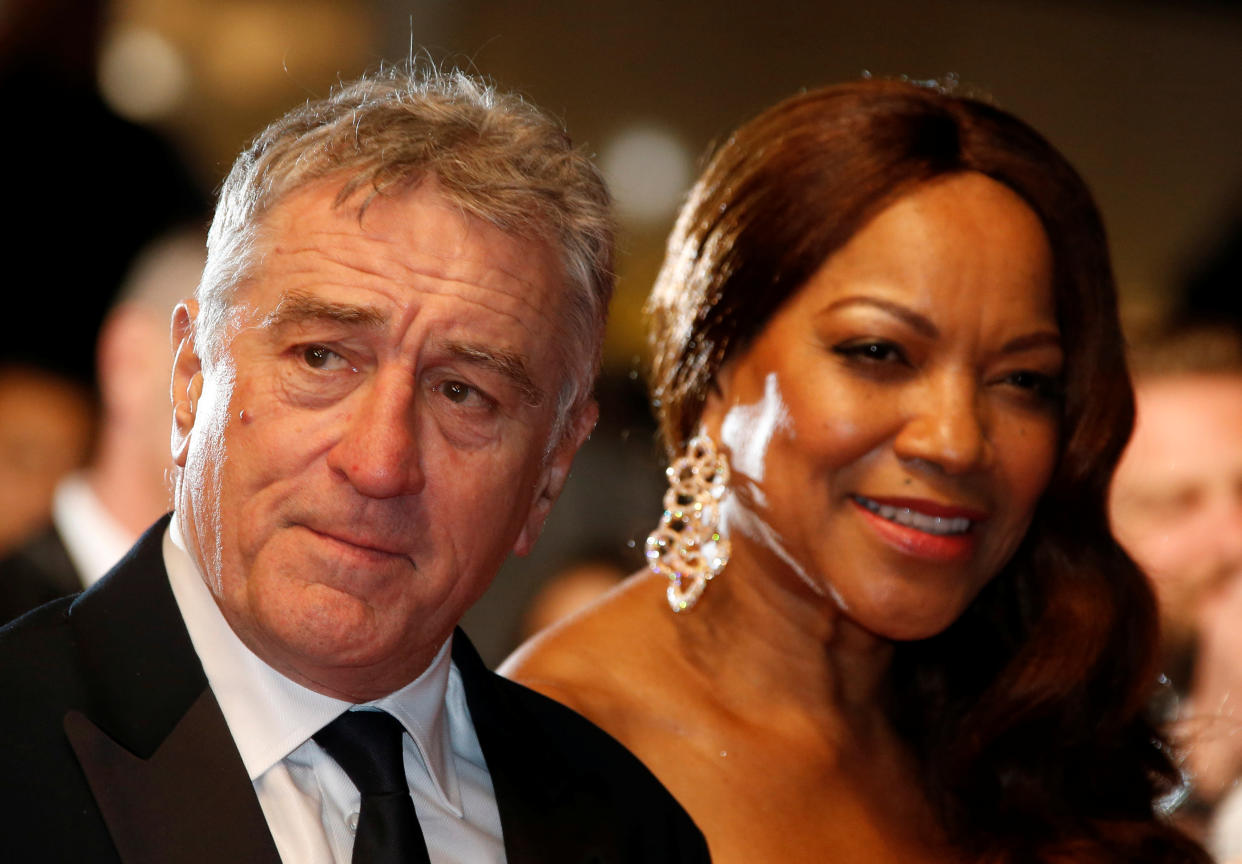 Cast member Robert De Niro and his wife Grace Hightower pose on the red carpet as they arrive for the screening of the film "Hands of Stone" out of competition at the 69th Cannes Film Festival in Cannes, France, May 16, 2016.  REUTERS/Eric Gaillard