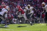 Georgia wide receiver Dominic Lovett (6) runs for a touchdown against Missouri during the first half of an NCAA college football game, Saturday, Nov. 4, 2023, in Athens, Ga. (AP Photo/John Bazemore)