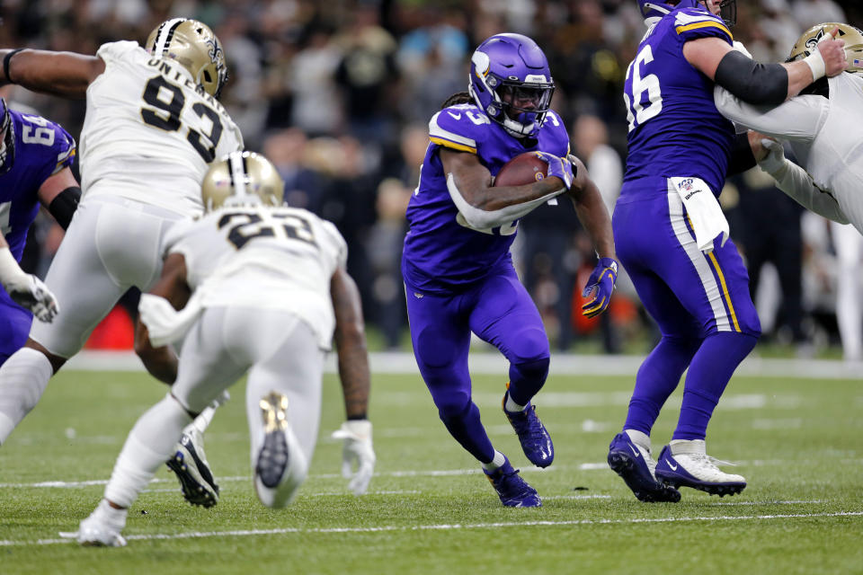 Minnesota Vikings running back Dalvin Cook (33) carries in the first half of an NFL wild-card playoff football game against the New Orleans Saints, Sunday, Jan. 5, 2020, in New Orleans. (AP Photo/Brett Duke)