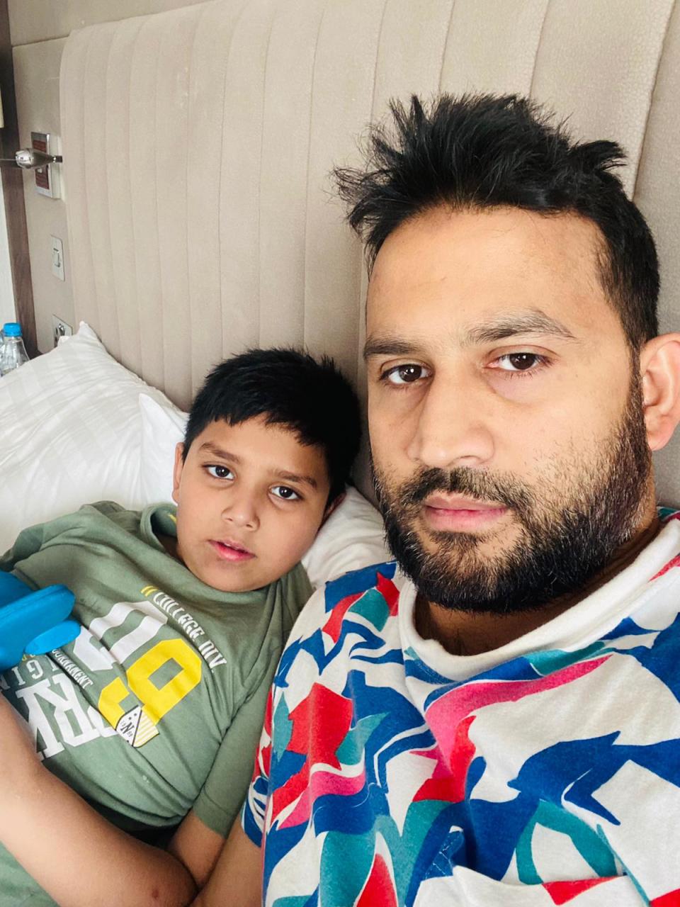 Mr Azam and his son, nine-year-old Ahmed, in their hotel room at the Crown PlazaShaiful Azam