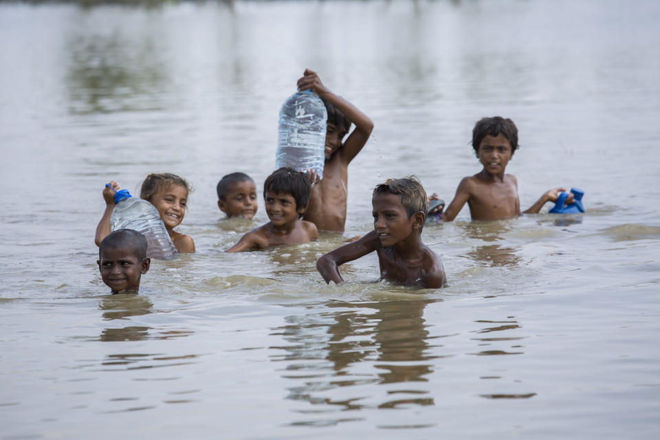 Children fill water bottles and play with each other in one of the areas worst affectedSaiyna Bashir/Arete/WFP